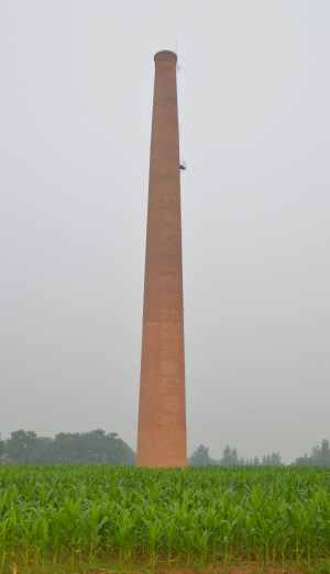 China: A lonely chimney in a corn field is all that is left from a brick factory in rural Henan province