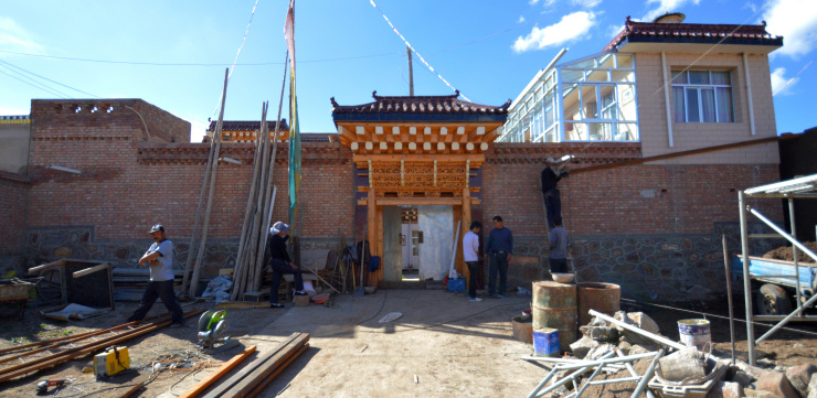 Tibetans building a new house in the traditional style of the region